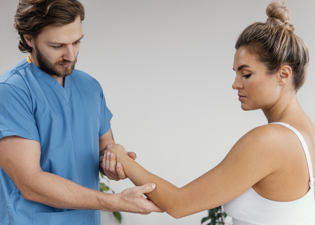 side-view-male-osteopathic-therapist-checking-female-patient-s-elbow-movement